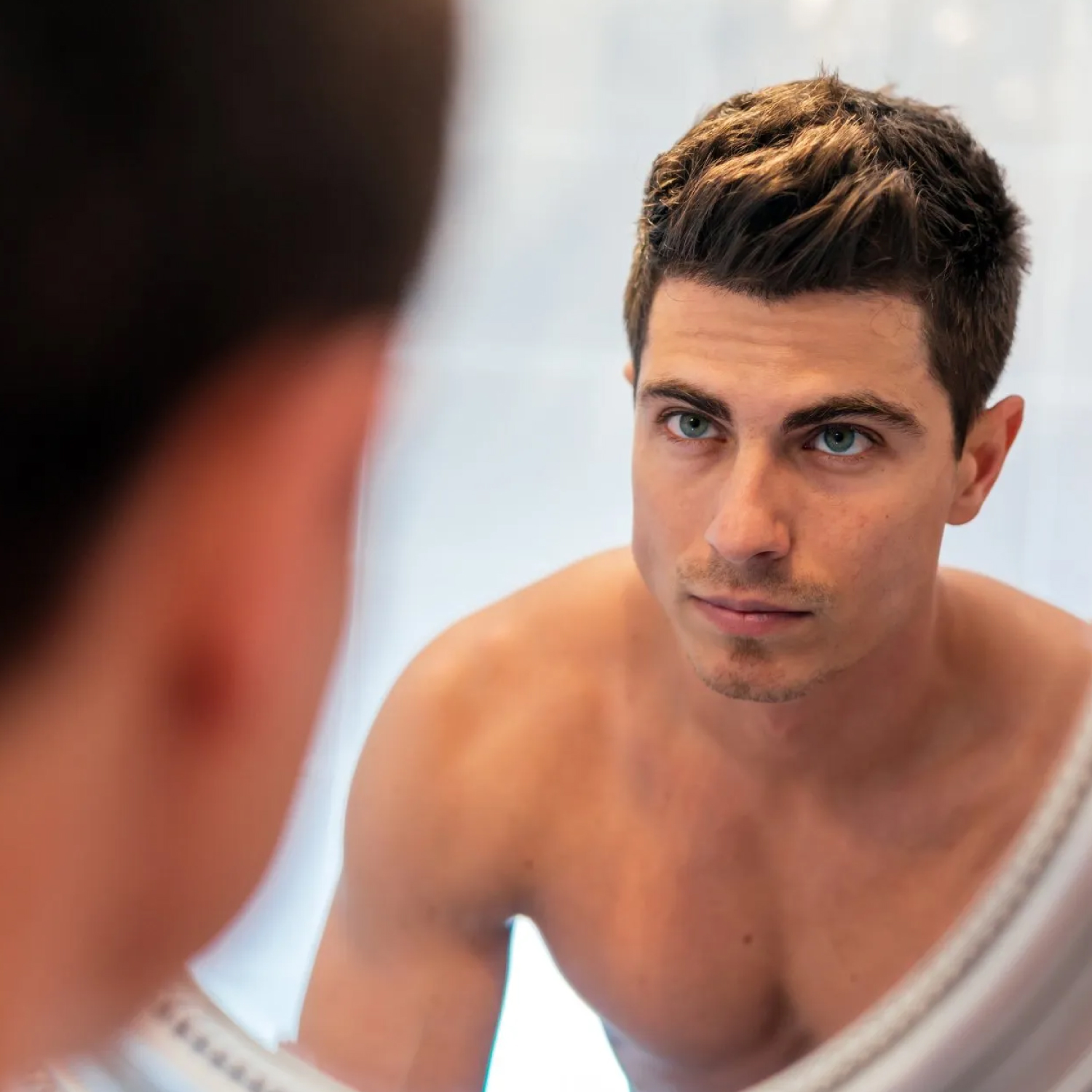 Man looking at himself in mirror