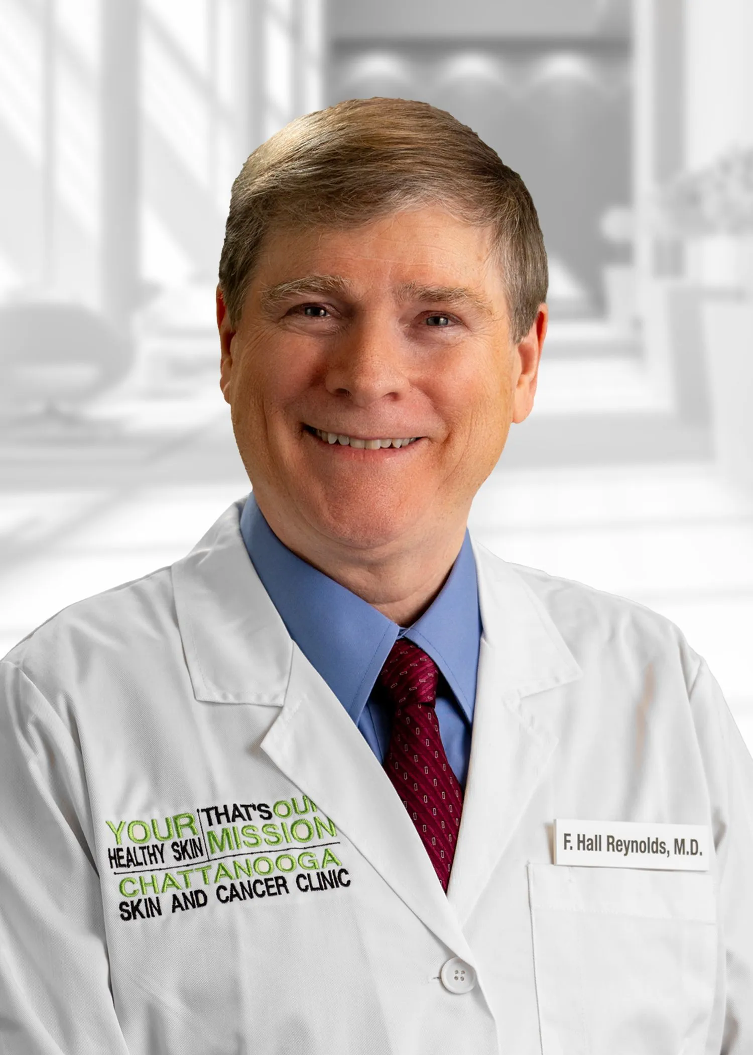 Smiling doctor in white coat