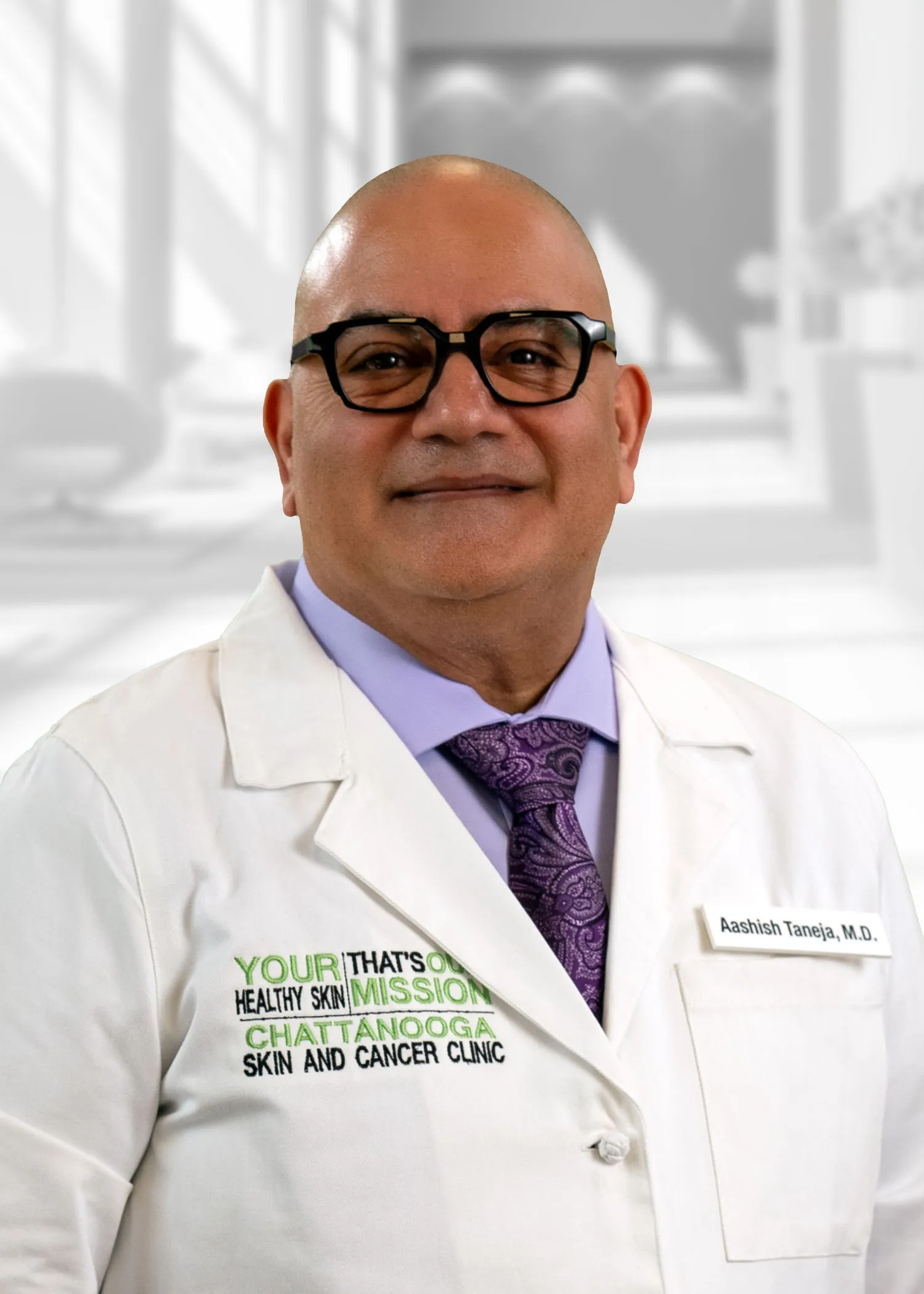 Doctor in lab coat, smiling confidently
