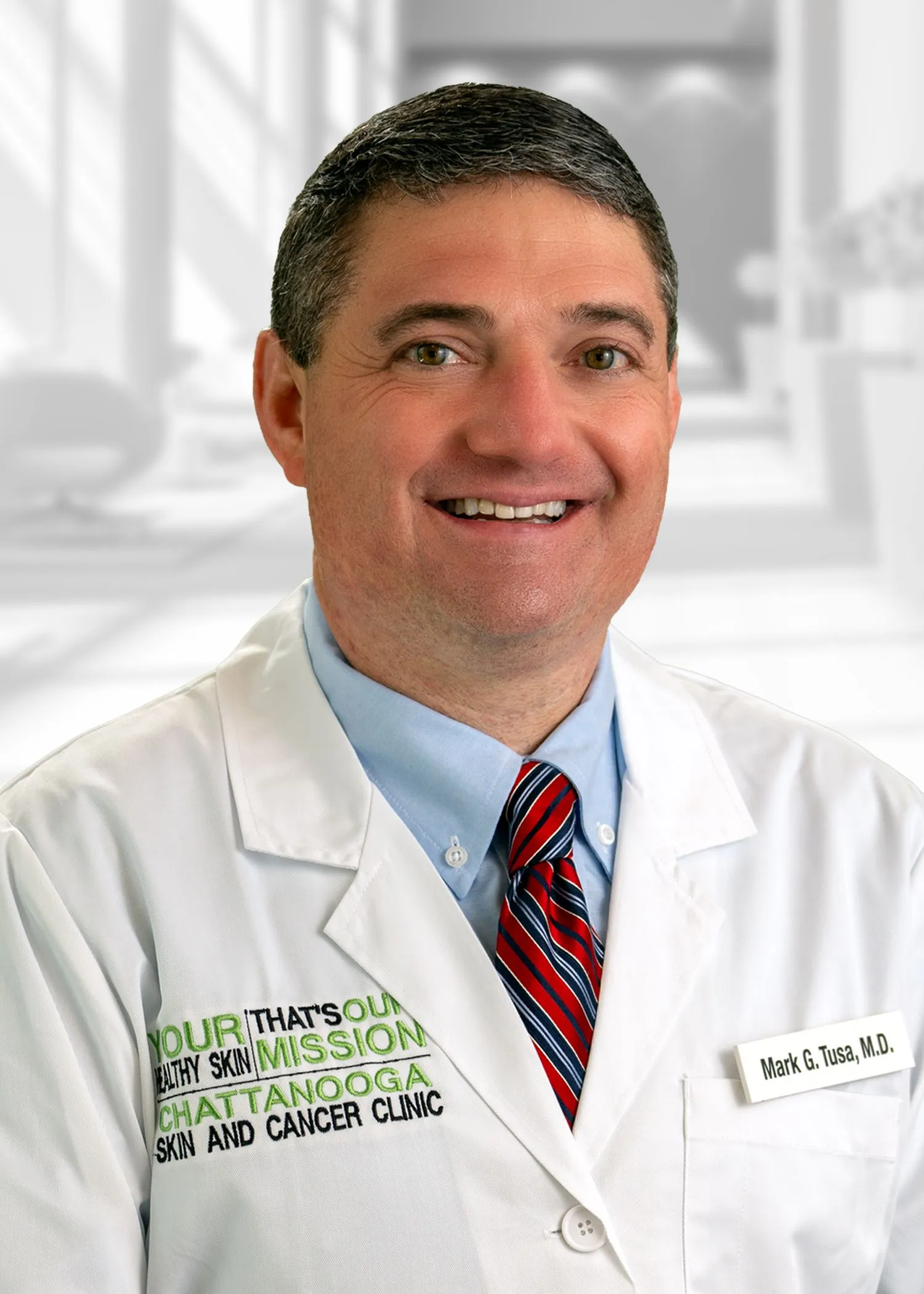 Smiling doctor in white coat