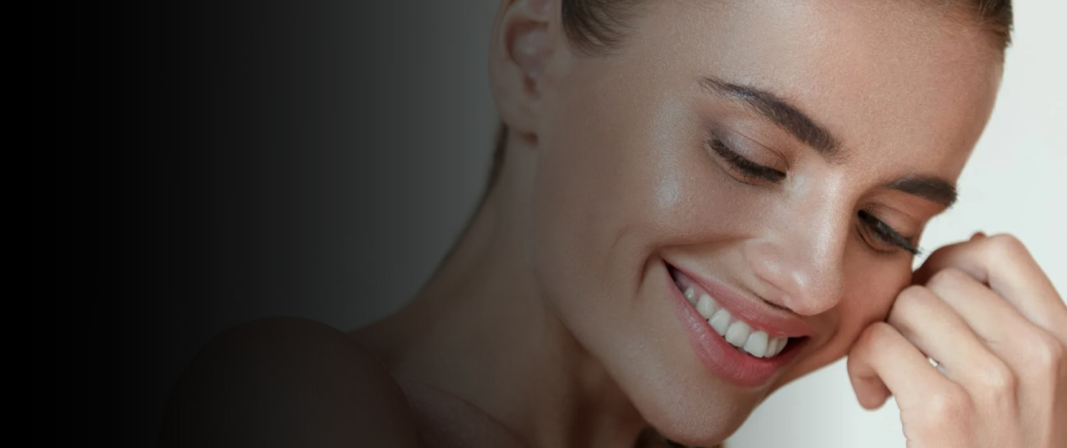 Smiling woman with glowing skin