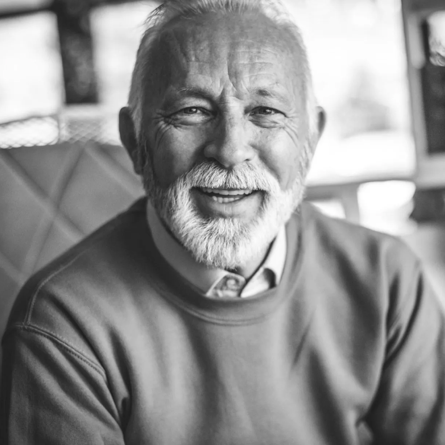 Smiling elderly man with a beard