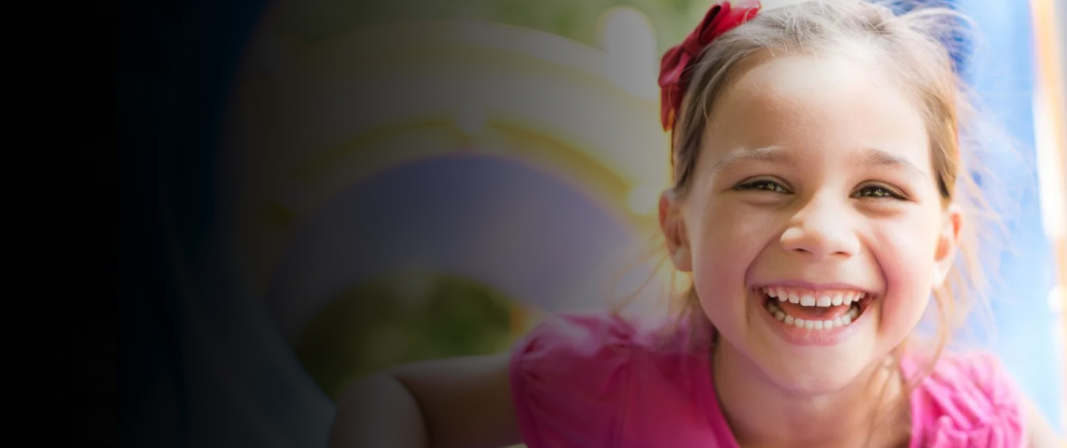 Smiling girl playing in a playground