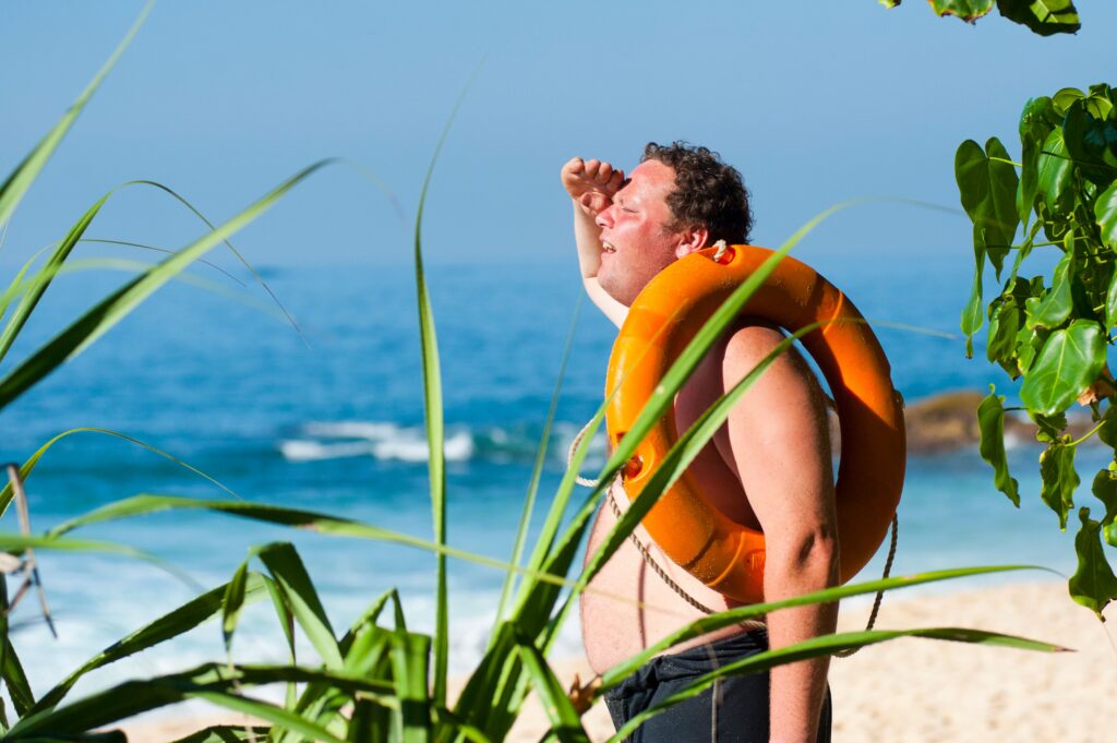 Man with sun-exposed skin at the beach needing the best sunscreen for rosacea acne-prone skin